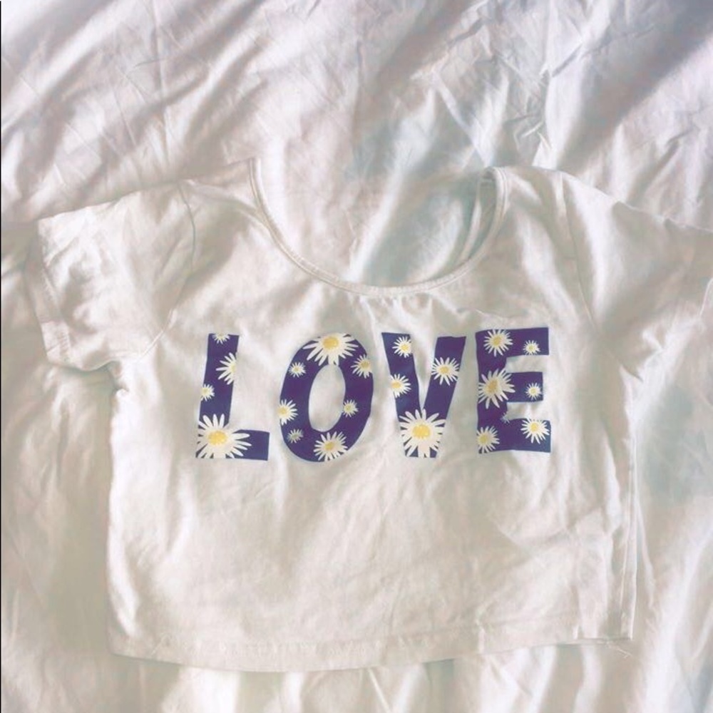 White crop top with the word love across it